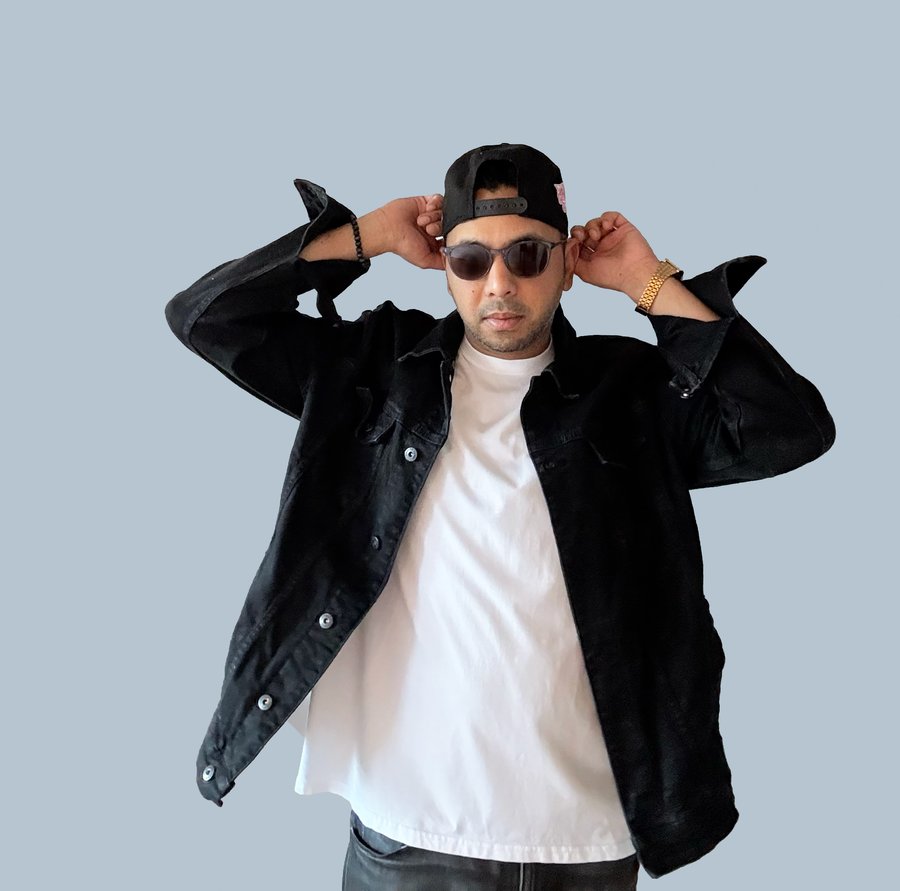 LMD in black denim jacket, cap